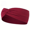 A maroon knitted elastic sports headband is shown folded and knotted.