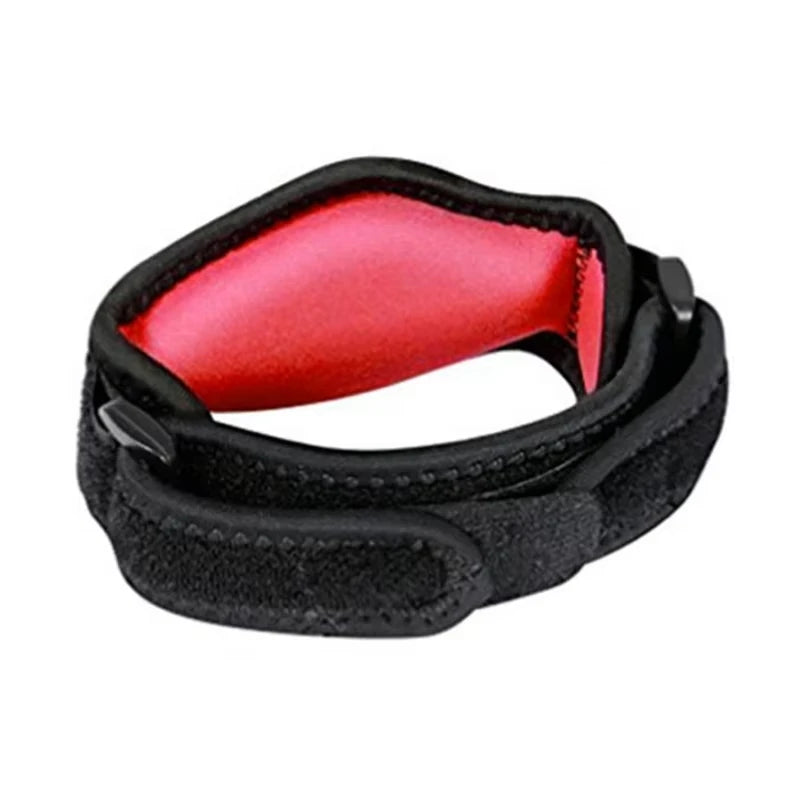 Black tennis elbow support brace with a red padded insert shown from the side.