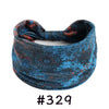 A dark blue and reddish patterned boho knotted cotton headband.