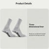 Une paire de chaussettes de liner blanches en 3D avec des grips noirs, montrées sur un fond clair.