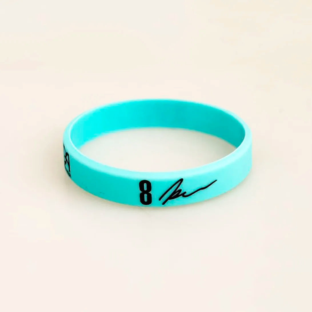 A bright cyan silicone wristband with the number 8 written on it.