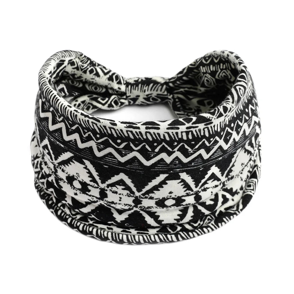 Black and white patterned bohemian cotton stretch headband tied in a bow