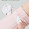 Close-up of a pink sun protection arm sleeve with an adjustable elastic buckle detail.