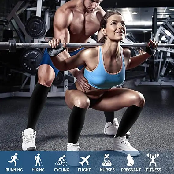 A muscular woman lifts a barbell while another woman holds a long bar, demonstrating fitness and strength.