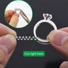 A set of invisible ring sizer tools showing a ring and a cutting point on the band.