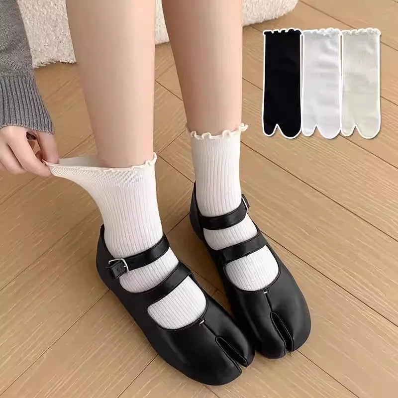 Black ruffle cuff knit crew socks and matching black slides for women