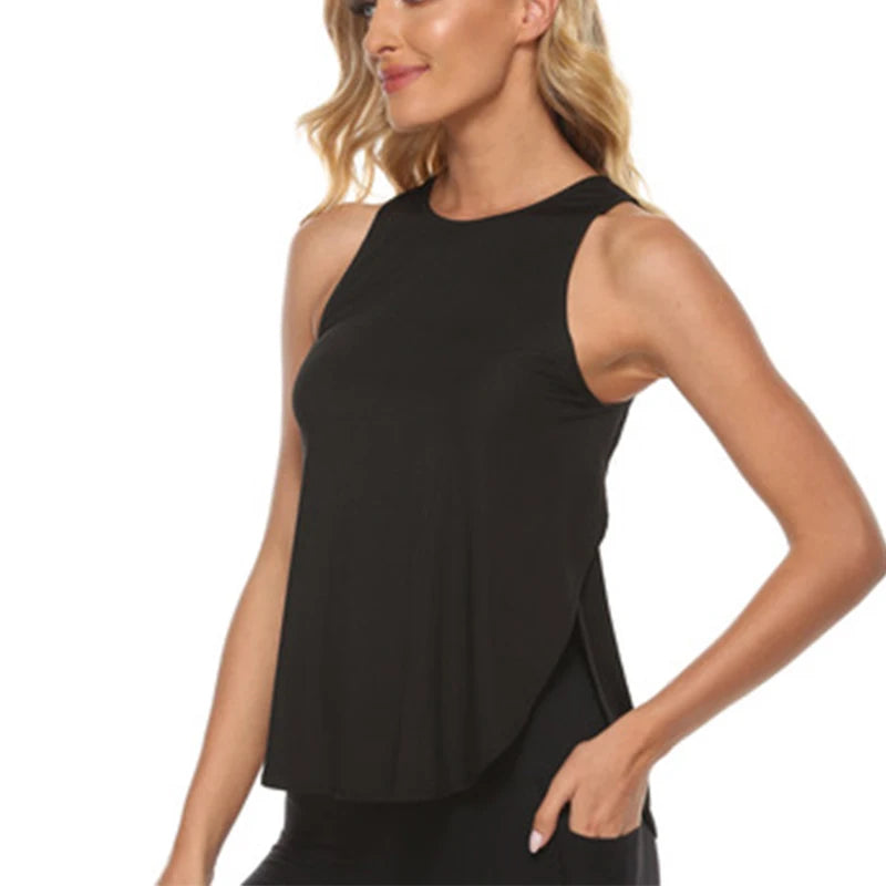 A woman wearing a black quick-dry yoga and gym tank top.