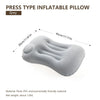 A grey press type inflatable pillow shown from the side with dimension markings.