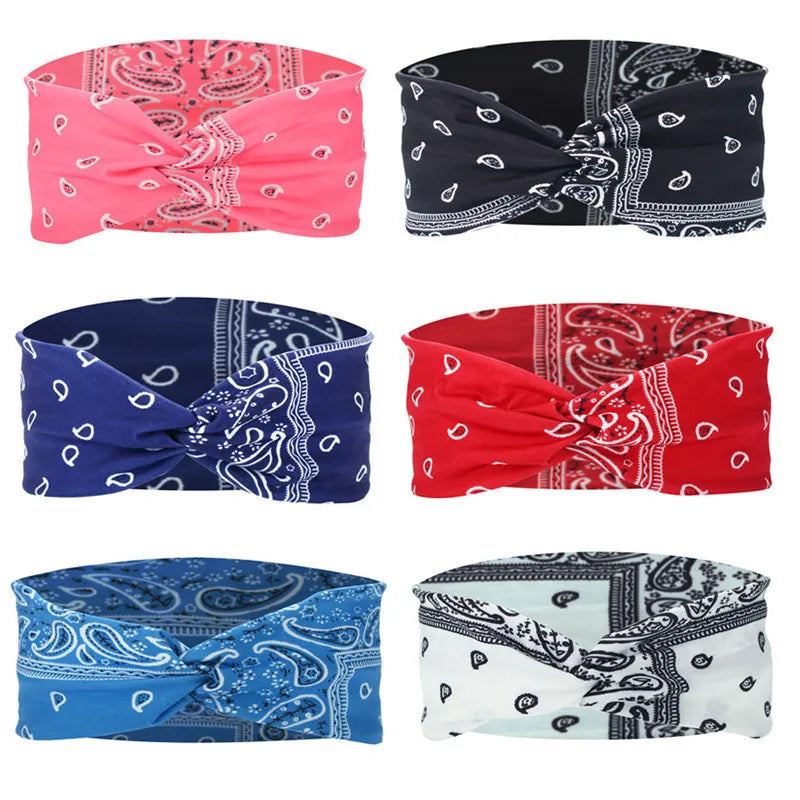 A collection of eight colorful bohemian print wide headbands for yoga and running.