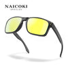 A pair of black NAICOKI spectacles with bright yellow polarized lenses shown against a white background.