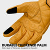 A close-up of tan leather motorcycle riding gloves showing a thickened palm design.
