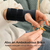 A hand is holding a black supportive wrist splint, demonstrating its use as an ambidextrous brace for wrist pain relief.