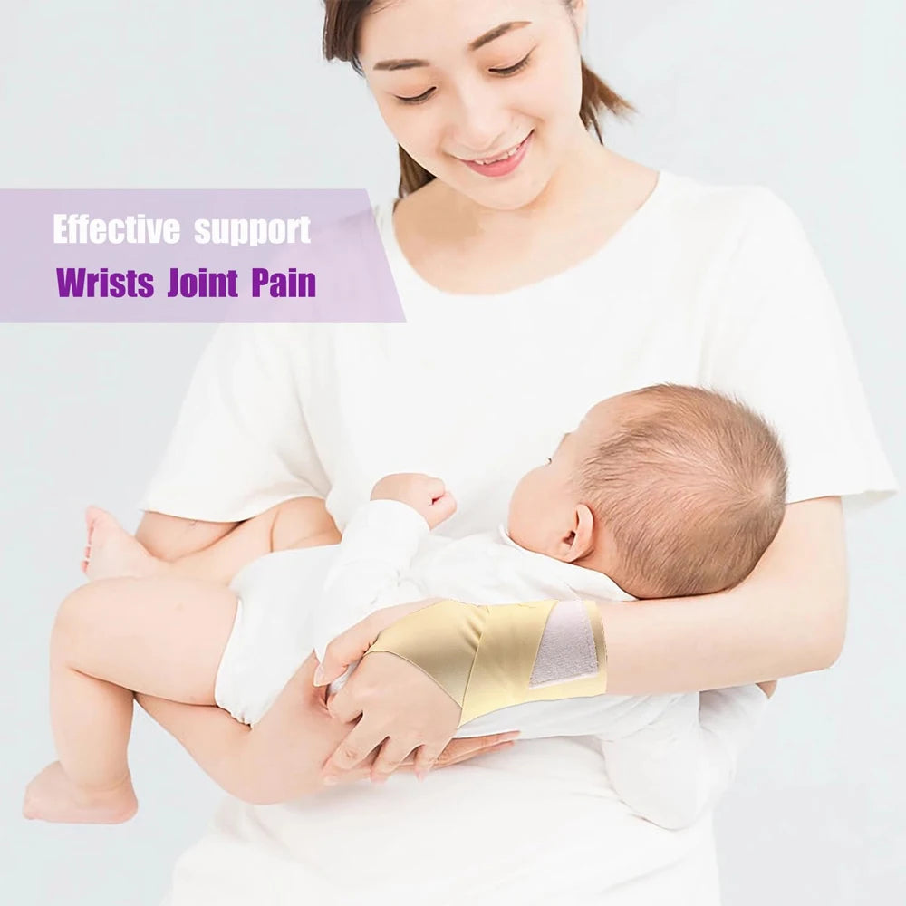 A woman is supporting a baby's wrist with a gold compression strap to alleviate joint pain.