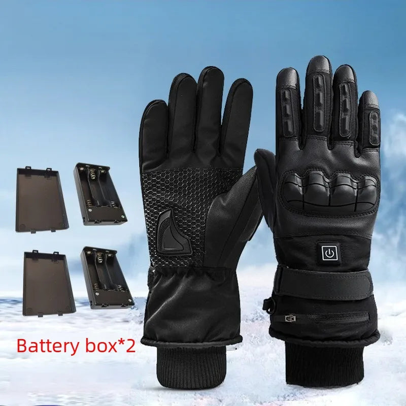 A pair of black heated thermal gloves and two battery boxes are shown against a snowy background.