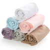 A stack of rolled ice sleeves in various pastel colors including white, light blue, pink, and beige.