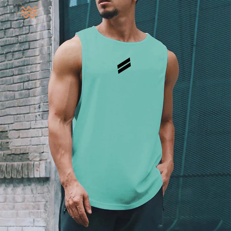 A muscular man wearing a light mint green sleeveless sports tank top with a black stripe logo.