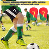 لقطة مقربة للاعب كرة قدم أخضر يرتدي شورتًا أسود وواقي الساق، مع أرقام حمراء مرقمة 7 و 77.