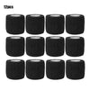 Twelve black elastic adhesive bandages in a circular roll format.
