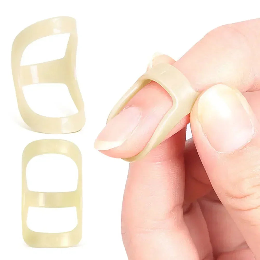 A hand is holding a beige ergonomic finger splint for joint support, showing different sizes and application.