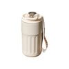 A beige insulated thermos bottle with a lid and a white strap is shown.