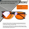 Orange lens blue light blocking glasses shown on a surface for computer work