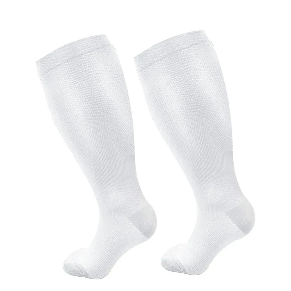 A pair of white compression socks shown from the side.