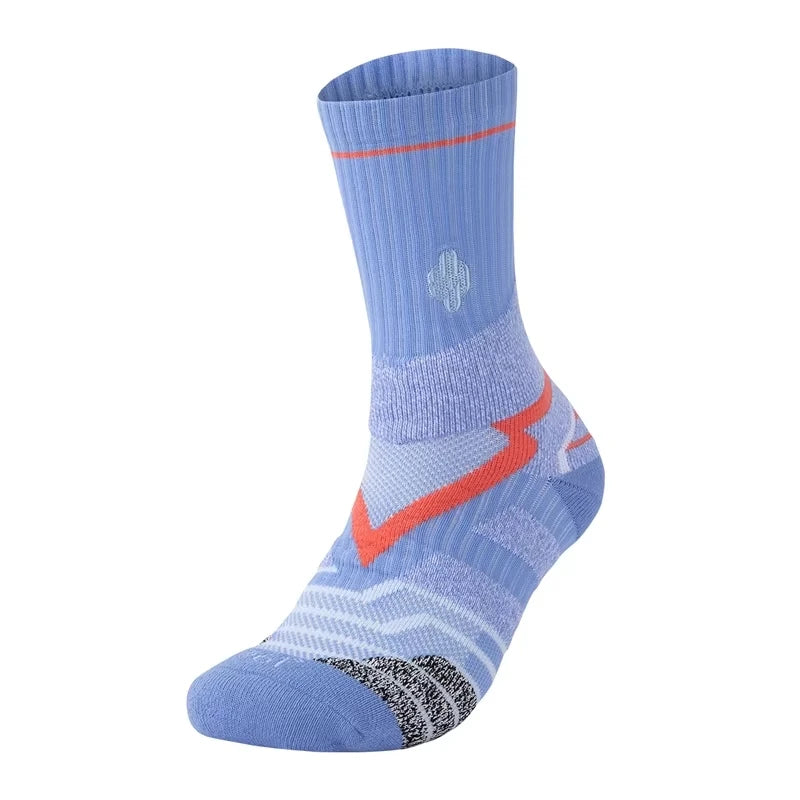 A light blue performance basketball running sock with orange accents and textured knit.