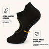 Black non-slip pilates yoga socks showing an open instep design and arch support features.