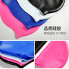 A collection of silicone swimming caps in various colors including blue, white, black, and pink.