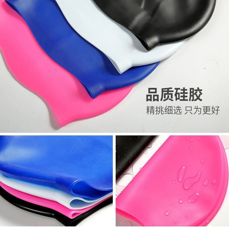 A collection of silicone swimming caps in various colors including blue, white, black, and pink.
