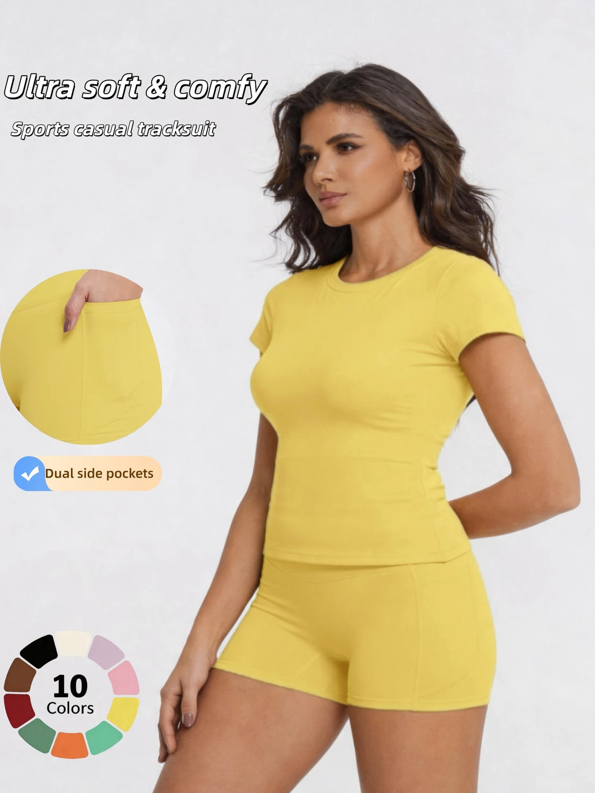 A woman models a yellow sports casual tracksuit top and shorts, highlighting dual side pockets.