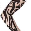 A close-up of a long seamless tattoo sleeve in black and beige swirling patterns.