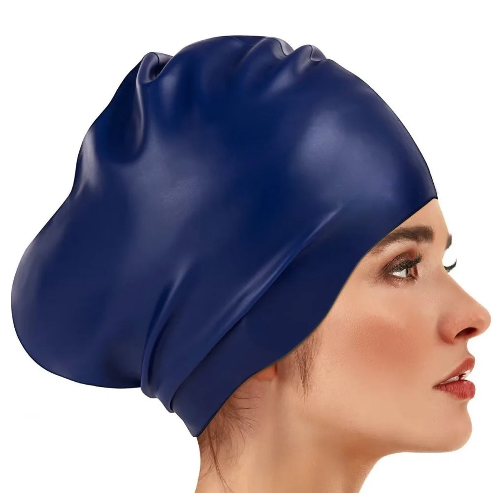 A navy blue silicone swim cap worn on a woman's head, showing its smooth texture and fit.