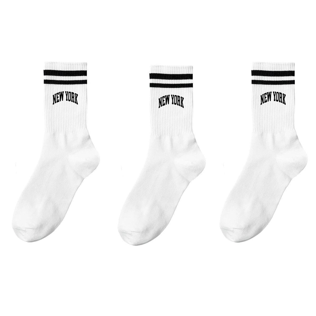 A set of white crew socks with black stripes and the text NEW YORK on them.