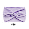 A lavender boho wide turban headband folded into a knot.
