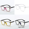 A set of four optical glasses frames in various colors including pink, clear, yellow, and blue, shown against a white backgro
