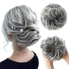 A woman's back shows a messy curly hair bun hairstyle with gray extensions, alongside examples of the style.
