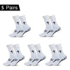 Five pairs of black and white performance athletic socks for sports and fitness