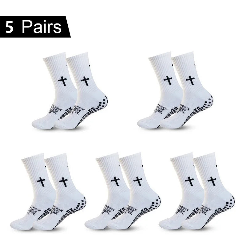 Five pairs of black and white performance athletic socks for sports and fitness