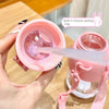 A hand is holding a pink silicone sealing ring and a water bottle, demonstrating the built-in sealing feature.