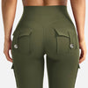 A model wearing olive green high-waisted flared fitness pants with multiple pockets.