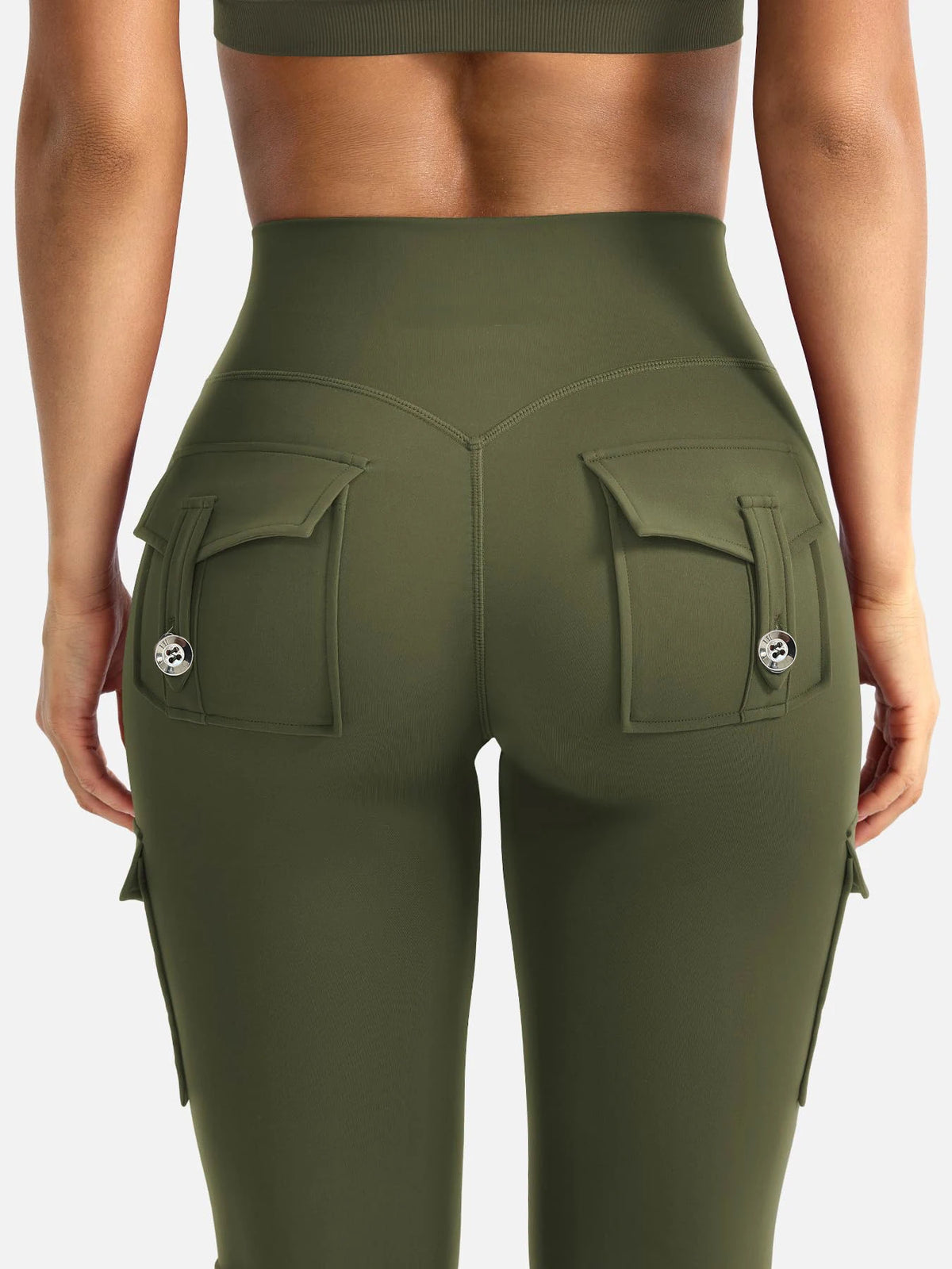 A model wearing olive green high-waisted flared fitness pants with multiple pockets.