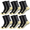 A set of black and beige non-slip grip socks for sports, shown from the side.