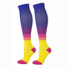 A pair of compression elastic socks featuring a gradient design from purple to yellow with pink accents.
