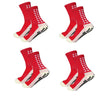 A set of red and white silicone grip socks for men, shown from above.