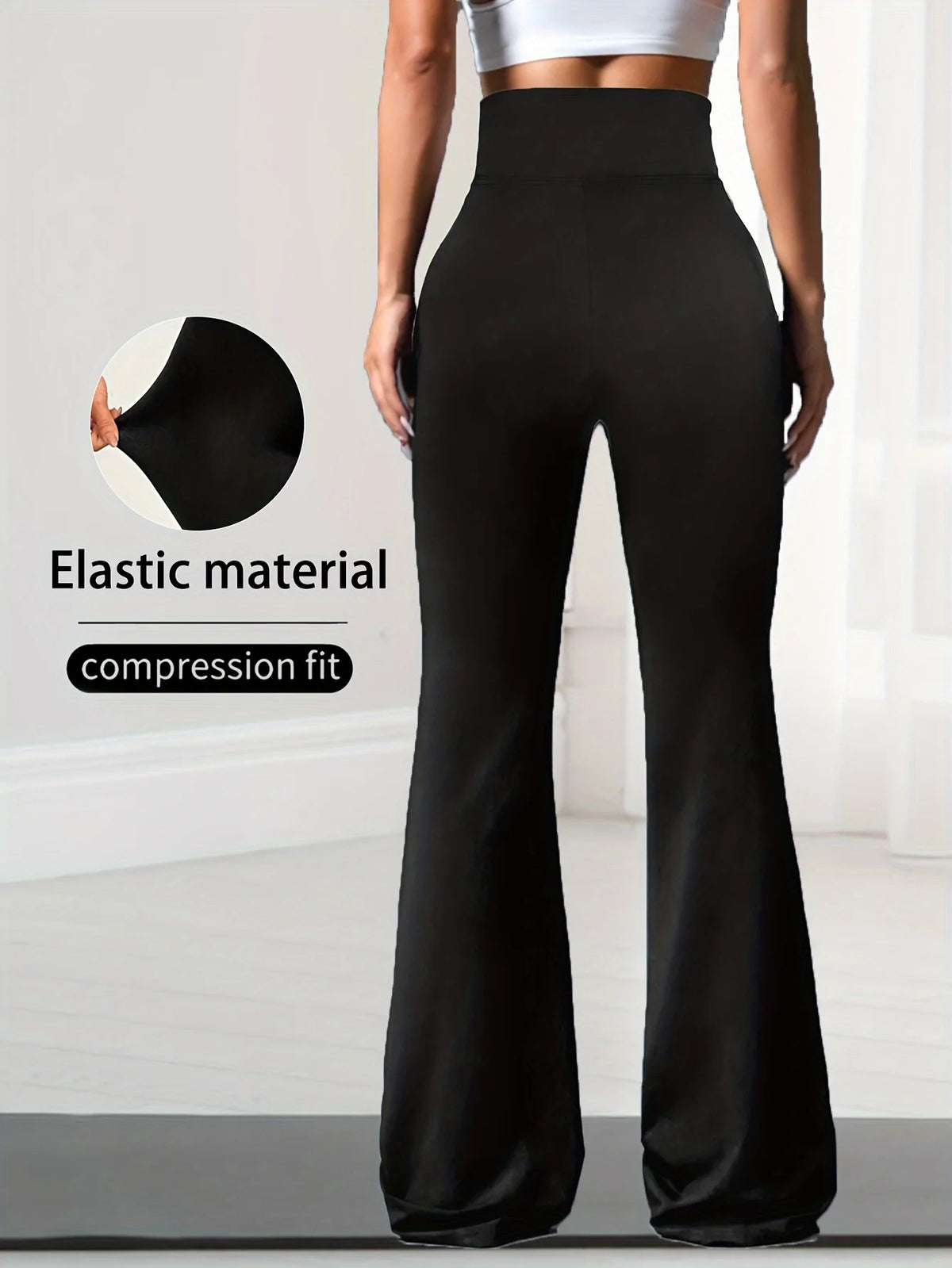 A model wearing black compression fit elastic material maxi pants.