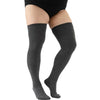A pair of charcoal gray thigh high leg warmers worn on a person's legs.