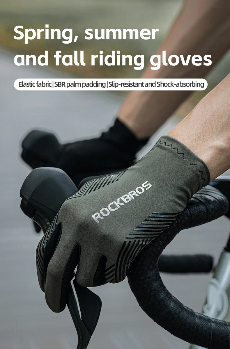 Close-up of olive green cycling riding gloves being worn on a hand, ready for use.