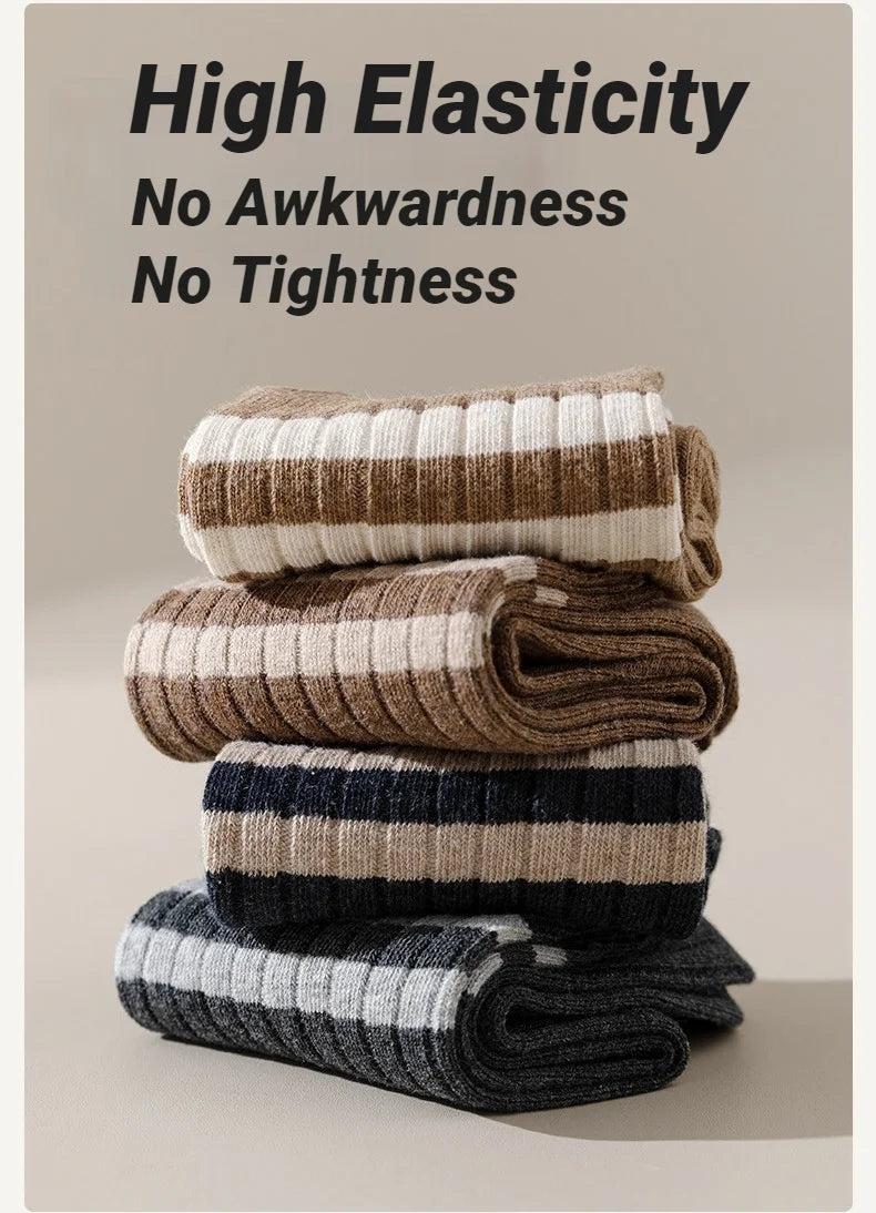 Stack of high elasticity striped men's socks in beige, brown, and gray tones.