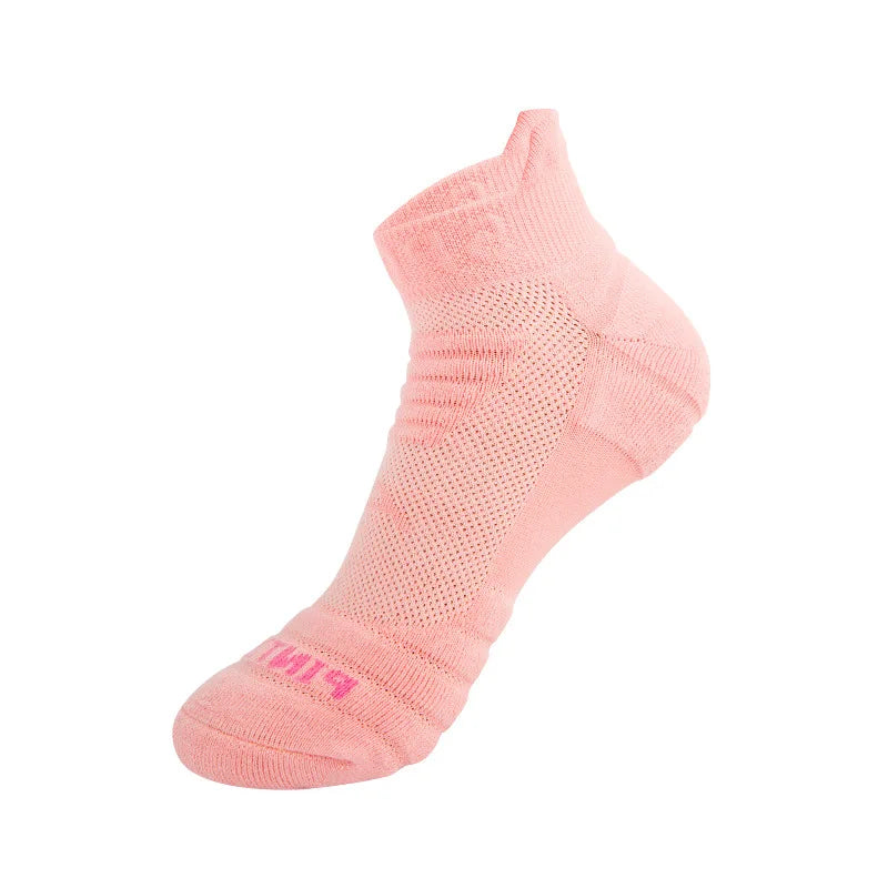 A single pink athletic ankle sock with a mesh design is shown from the side.
